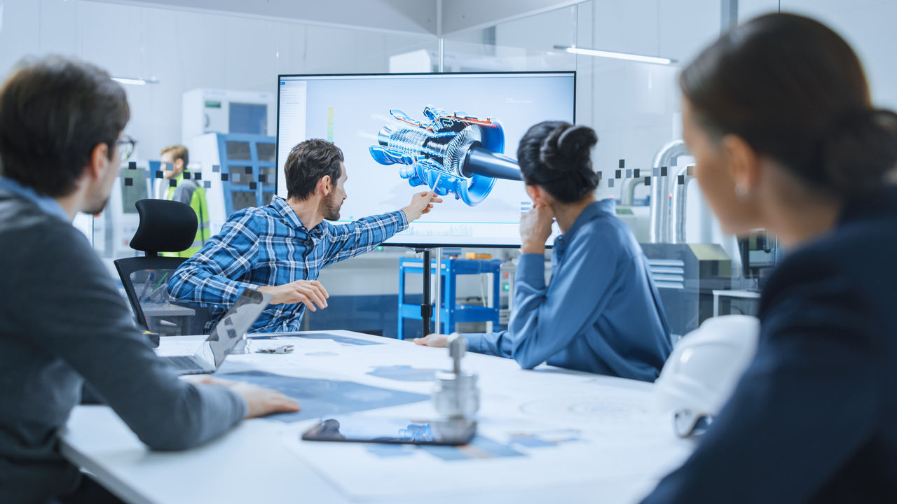 Modern Factory Office Meeting Room: Diverse Team of Engineers, Managers and Investors Talking at Conference Table, Use Interactive TV, Analyze Sustainable Energy Engine Blueprints. High-Tech Facility; Shutterstock ID 1842786364; purchase_order: -; job: -; client: -; other: -
